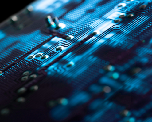 Close Up Of An Illuminated Blue Electronic Circuit Board